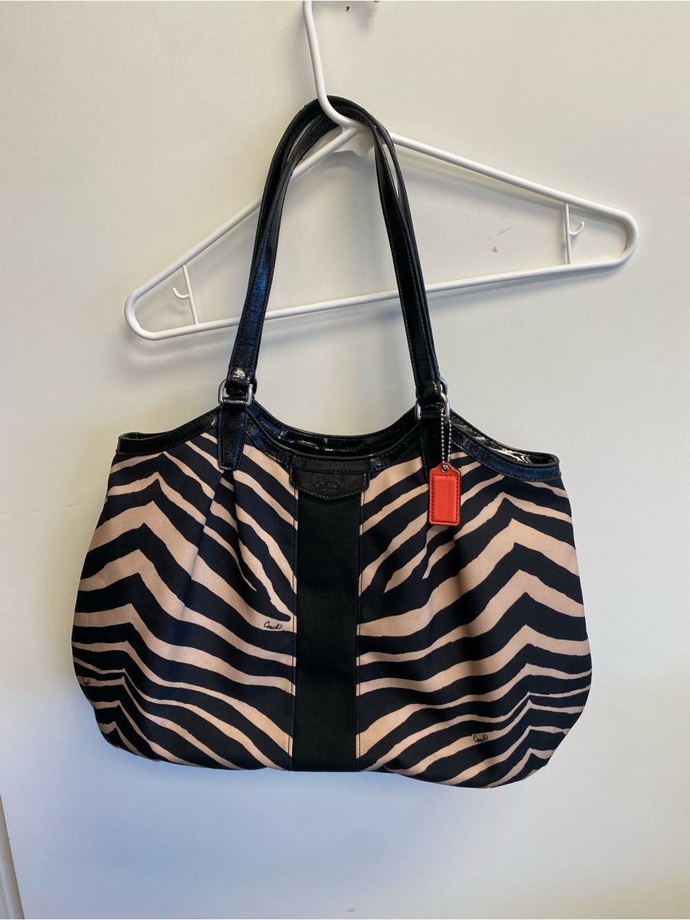 Coach Black and Beige Zebra-Print Tote with Red Accent Tag